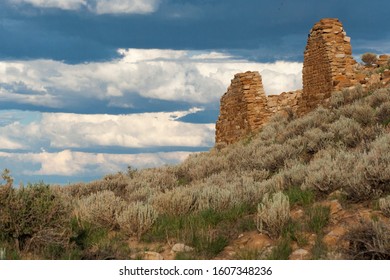 Evening light and dramatic clouds behind the Tsin Kletzin dwelling ruins at Chaco Historical Park