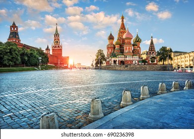 Evening light on Red Square. The St. Basil's Cathedral and the Spassky Tower in the rays of the setting sun. - Shutterstock ID 690236398