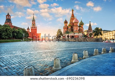 Evening light on Red Square. The St. Basil's Cathedral and the Spassky Tower in the rays of the setting sun.