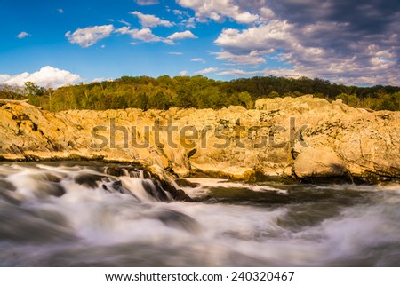 Evening light on rocks and rapids in the Potomac River, at Great Falls Park, Virginia.