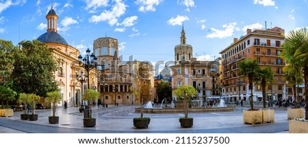 Evening panoramic view of Square of Saint Mary or Virgens square with Valencia Cathedral Temple, Basilica de la nuestra senora de los desamparados and the rio tura fountain in old town Valencia Spain