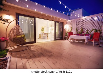 evening patio area with open space kitchen and sliding doors