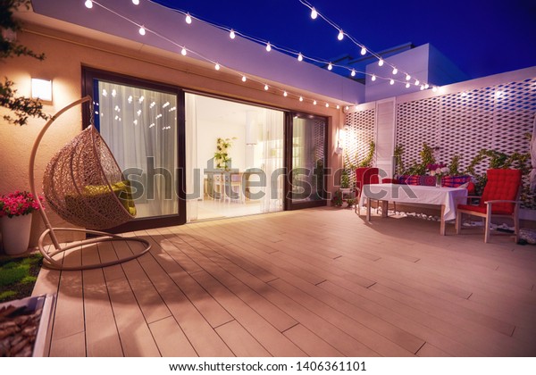 evening patio area with open space kitchen and\
sliding doors