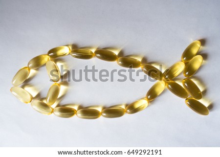 Evening primrose oil supplement capsules in a fish shape