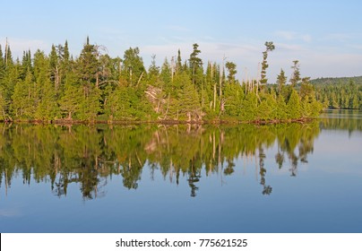 Evening Reflections On Lake Ogishkemuncie In The Boundary Waters Wilderness In Minnesota