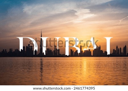 Evening Remote View of Dubai City with Sun Light and Letters DUBAI is half hided behind the city 