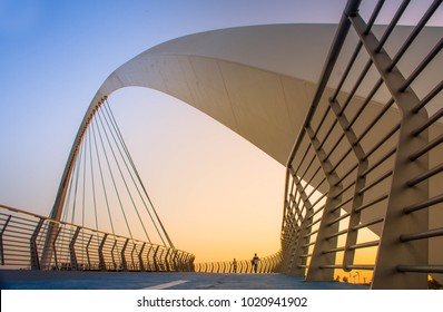 Evening Shot Of Dubai FamousWater Canal Bridge
New Attraction Of Dubai City, Place To Visit In UAE, Tourist Place In Dubai, Travel Destination, Modern Architecture Beautiful Sunset At Tolerance Bridge