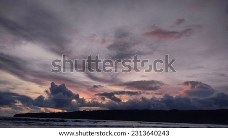 The evening sky before sunset ends which is so captivating. Rows of clouds can be seen painting the horizon line from nature. The combination of shades of red, orange, yellow, navy blue, gray and whit