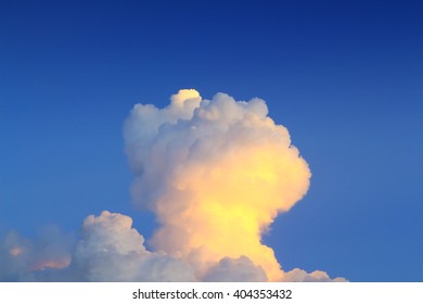 evening sky with clouds formed approximates a mushroom cloud due to angle.