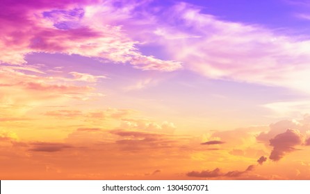 Evening Sky With Cloudy And Yellow Orange Sundown Light And Purple Pink Color Light