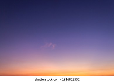 Evening sky on twilight with colorful orange sunlight and purple dark blue background, Dusk sky beautiful. - Shutterstock ID 1916822552