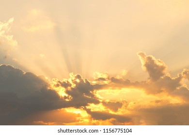 Evening sky with rays from behind the clouds. Sunlight coming from behind the clouds.