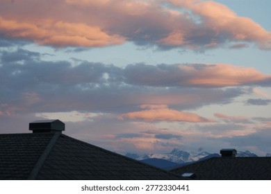 Evening sky with rooftops in the foreground
