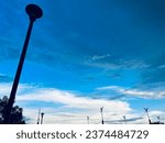 Evening sky with various lamp posts