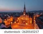 Evening skyline cityscape of Liberec, Czech Republic. Panoramic aerial view of the old town (staré město): main square and city hall at night