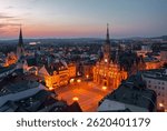 Evening skyline cityscape of Liberec, Czech Republic. Panoramic aerial view of the old town (staré město): main square and city hall at night
