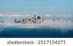 Evening Skyline of Downtown San Francisco, California, by the Bay through the typical fog. Major tourist destination in the United States