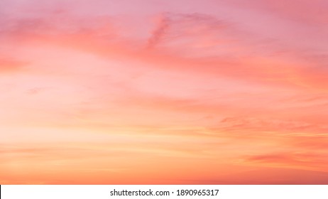 Evening Sky,Pink sky background with Romantic colorful sunlight with orange, yellow and dramatic nature background. - Shutterstock ID 1890965317