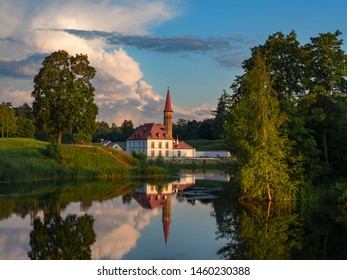 Evening summer landscape with a lake and a Palace. Gatchina.