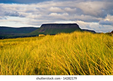 Evening Sun Lights Foreground Wild Grass And Benbulben Mountain Seen From Streedagh Strand In Co.Sligo, Ireland