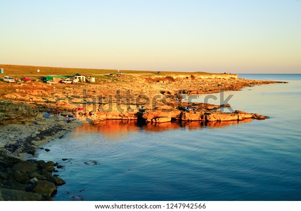 In the evening at sunset.
Camping on the shore of the Black sea in the area of
Tarkhankut.Crimea,