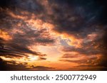 Evening sunshine background. Yellow orange sky colors landscape. Incredible dramatic sky.