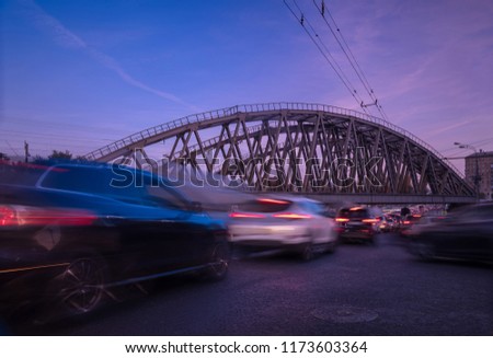 evening traffic under the railway bridge
