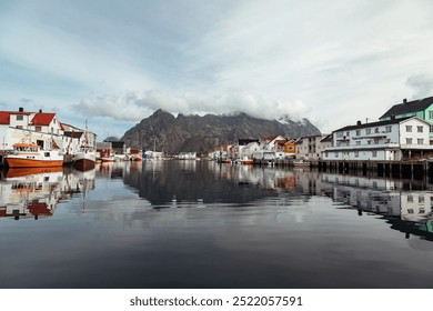 Evening Tranquility in Henningsvær, Lofoten Islands With Reflections of Colorful Buildings and Mountains - Powered by Shutterstock