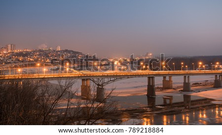 Evening view of bridge over White River in Ufa at winter, Russia,