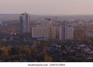 Evening view of the city. Sunset orange sky and beautiful cityscape, buildings and city streets, public place - Powered by Shutterstock