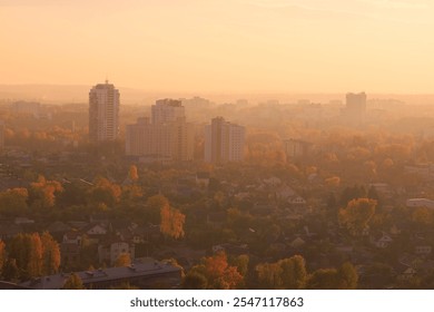 Evening view of the city. Sunset orange sky and beautiful cityscape, buildings and city streets, public place - Powered by Shutterstock