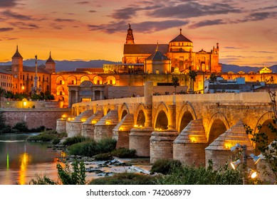 Evening view at the Mosque-Cathedral with Roman bridge in Cordoba - Spain - Shutterstock ID 742068979