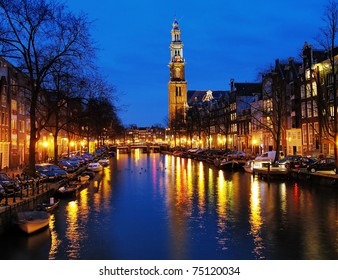 Evening view on the Western church from Prinsengracht channel in Amsterdam, Netherlands