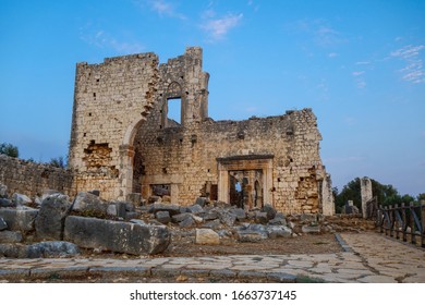 Evening View Onto Remains Of Gates  Walls Of Basilica In Ancient City Kanli Divane Or Canytelis, Ayaş, Turkey. It's Built In 2 Century AD. Building Stands Near Sinkhole (it's Fenced, Right Side)