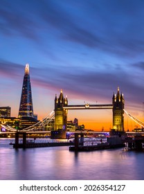 An evening view over the River Thames, of the stunning Tower Bridge and the Shard in London, UK.
