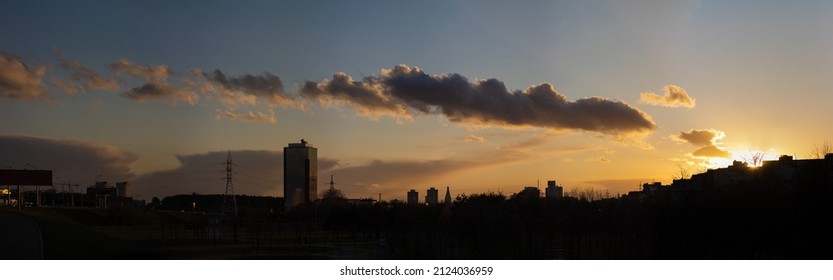 Evening view and sunset sky, urban landscape, silhouettes of houses and high-voltage transmission lines - Powered by Shutterstock