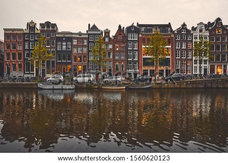 Similar – Image, Stock Photo Tranquil Amsterdam canal with iconic narrow houses