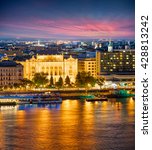 Evening view of Vigado Concert Hall on the Danube River embankment in Pest city. Colorful sanset in Budapest is World Heritage Site by UNESCO, Hungary, Europe. Artistic style post processed photo.