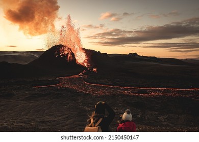 A Evening View Of The Volcano Eruption In Iceland  People Are Watching The Fiery River