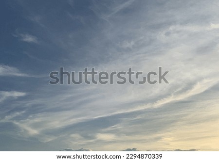Evening Visible high clouds, cirrus clouds and cirrocumulus clouds hitting the beautiful sunlight in the sky at Bangkok, Thailand.no focus