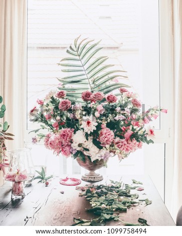 Similar – Florist woman arranges festive bouquet of flowers