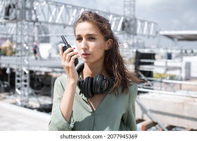 Event Manager Portrait. Installation Of Stage Equipment And Preparing For A Live Concert Open Air. Summer Music City Festival. Woman Works On The Stage.