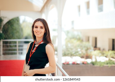 Event Planner Coordinator PR Specialist Employee at Formal Event 
Authorized manager wearing a badge welcoming guests at hotel entrance
 - Shutterstock ID 1261849543