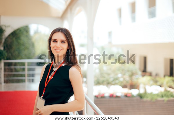 Event Planner Coordinator PR Specialist\
Employee at Formal Event \
Authorized manager wearing a badge\
welcoming guests at hotel\
entrance\
