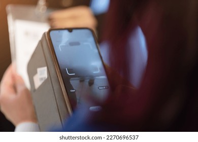 Event QR code ticket scanning. Businessman registering for a business conference using his smart phone