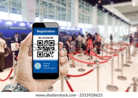 Event Registration Qr code concept.Man hands using mobile phone to check in on blurred people registration as background