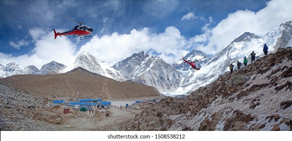 Everest base camp Gorakshep rescue helicopters in action Himalayas Nepal, small settlement that sits at its edge at 5,164 m elevation, near Mount Everest