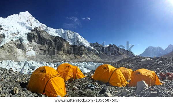 EVEREST BASE CAMP, NEPAL, 20\
October 2018 - View from Mount Everest base camp, tents and prayer\
flags, sagarmatha national park, trek to Everest base camp -\
Nepal