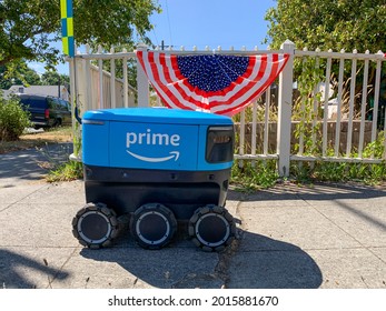 Everett, WA. USA - 07-28-2021: Amazon Prime Home Delivery Robot Navigating Sidewalk