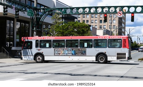 Everett, WA, USA - June 07, 2021; City Of Everett Transit Bus In The Downtown District Of The Snohomish County City In Washington State.  The Bus Is Gray And Red.